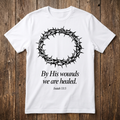 White t-shirt with a crown of thorns and text on a wooden background