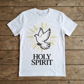 White t-shirt with a dove graphic and 'HOLY SPIRIT' text on a wooden surface