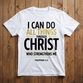 White t-shirt with motivational quote on a wooden surface