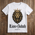 White t-shirt with a lion graphic and 'Lion of Judah' text on a wooden surface